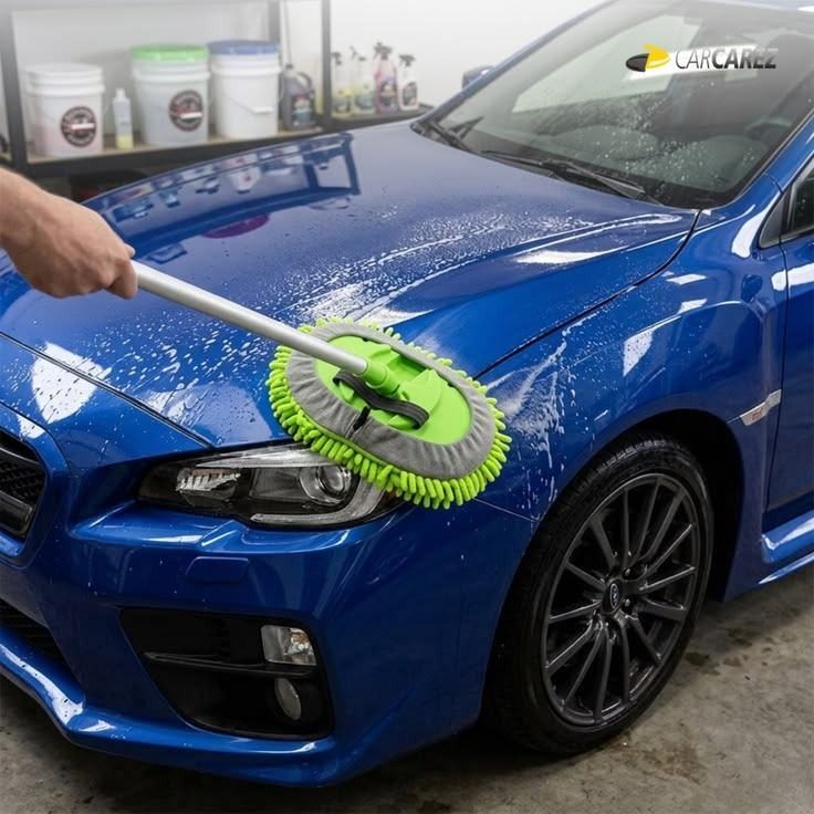 Microfiber wash mop on a blue car